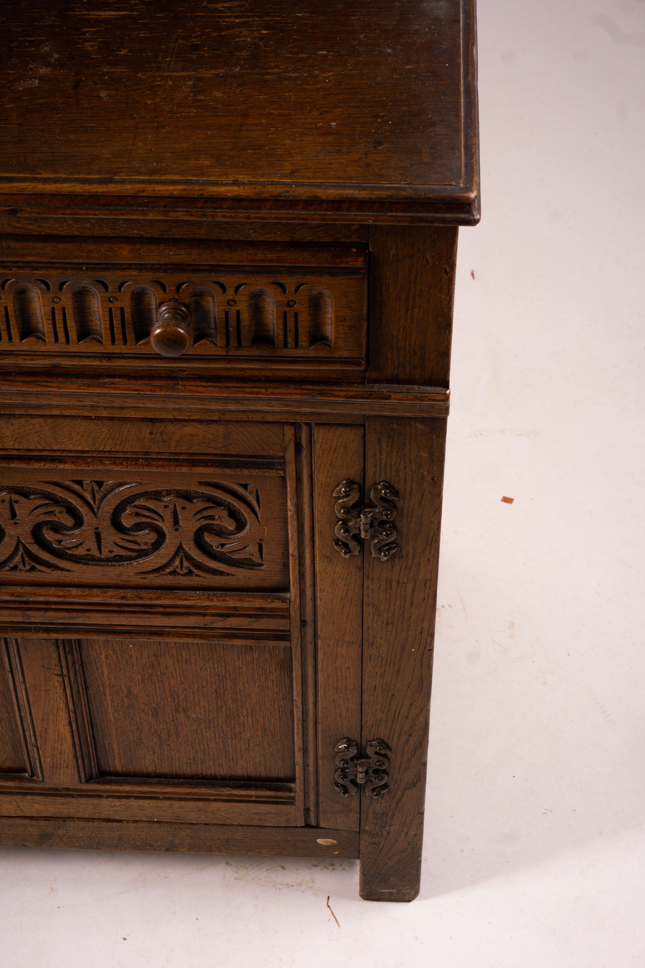 An 18th century style carved oak dresser, width 124cm, depth 46cm, height 175cm